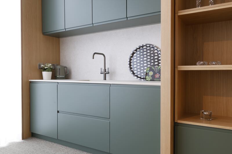 The custom-built kitchen and matching cabinetry is lacquered in Farrow & Ball 47, Green Smoke. Photograph: Nick Bradshaw 